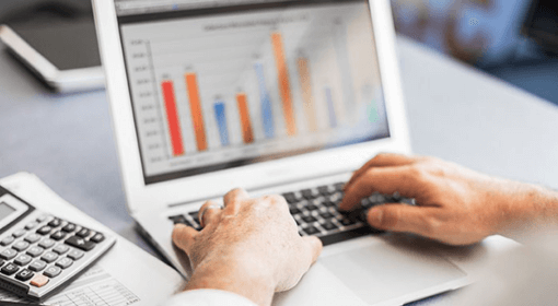 Commercial energy figures being reviewed on a laptop